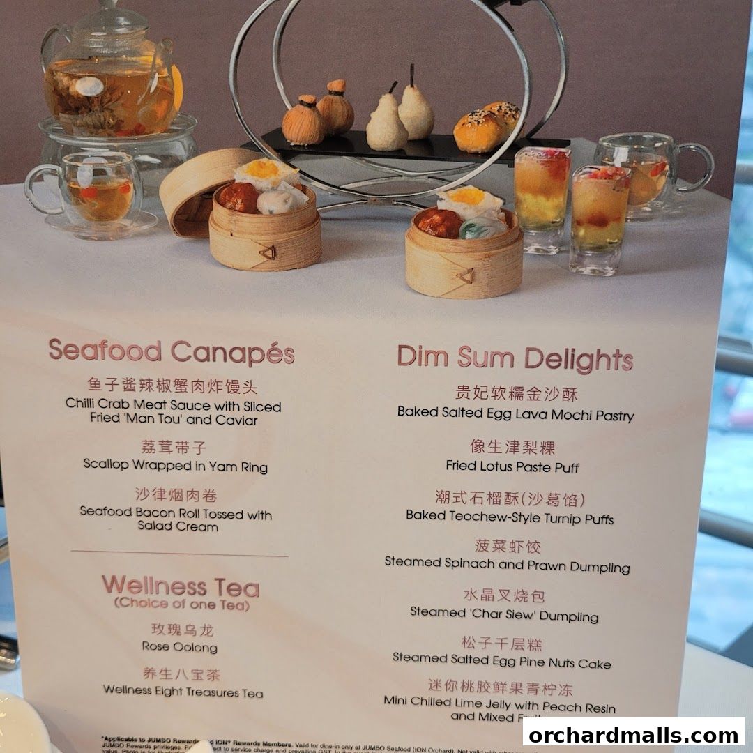 A menu featuring Seafood Canapés, Dim Sum Delights, and Wellness Tea.