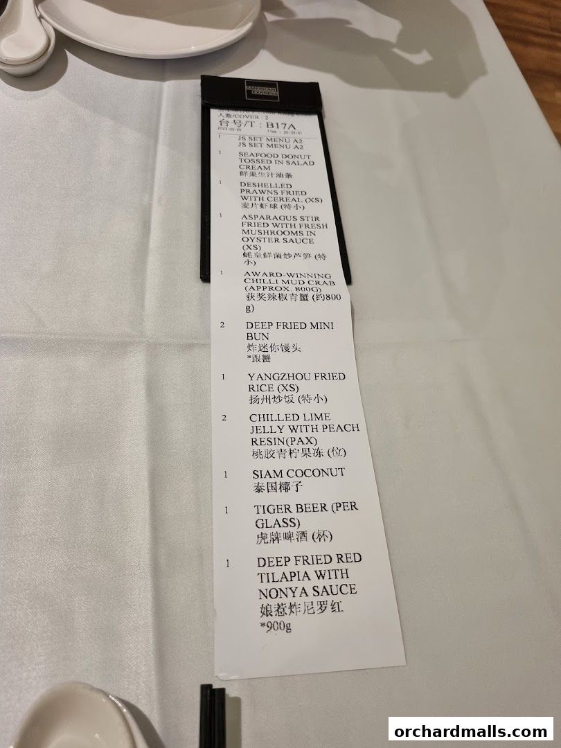 A close-up view of a JUMBO Seafood menu with various dishes listed.