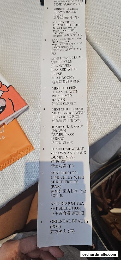 A close-up view of a menu from JUMBO Seafood, listing various dim sum and tea options.