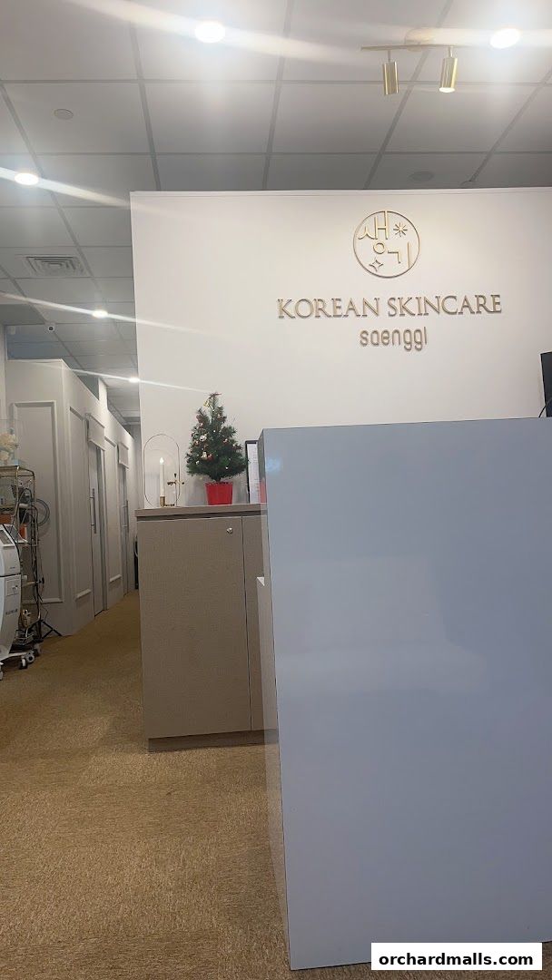 Interior view of K-Beauty Saenggi with a reception desk and Korean skincare branding.