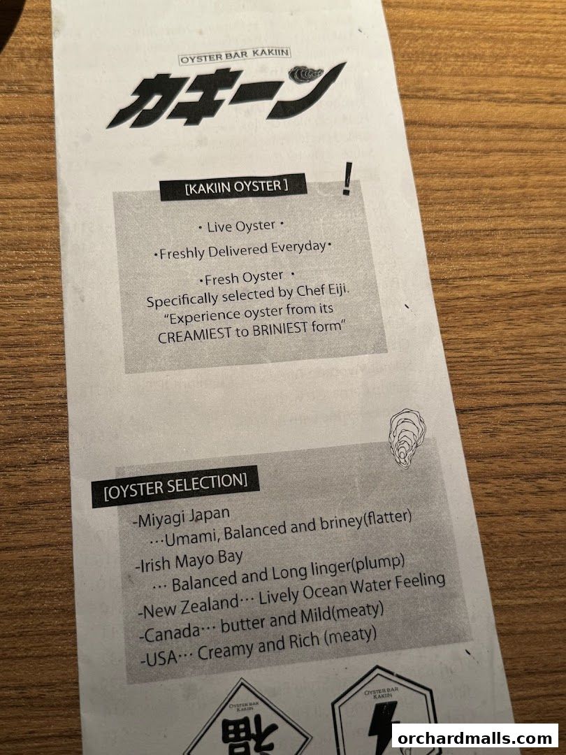 A menu from Kakiin Oyster Bar featuring live oysters and various oyster selections.