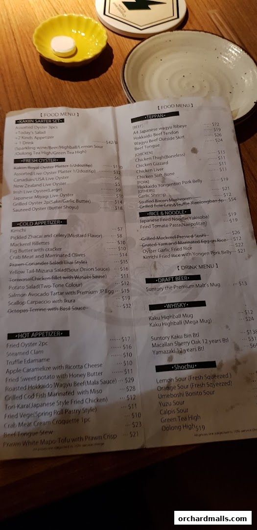 A menu from Kakiin Oyster Bar with various food and drink options.