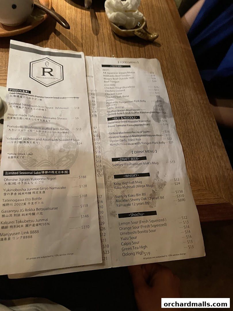 A menu from Kakiin Oyster Bar featuring Japanese dishes, sake, and drinks.