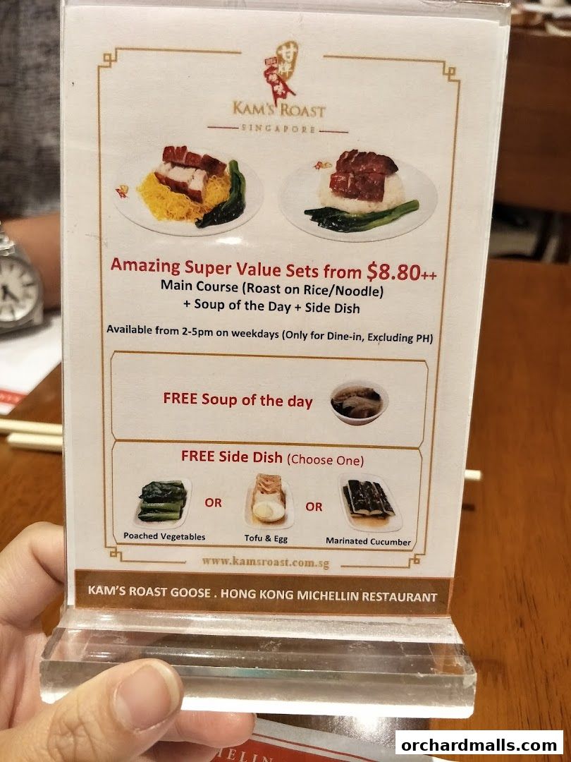 A menu display for Kam's Roast Express featuring value sets and side dish options.