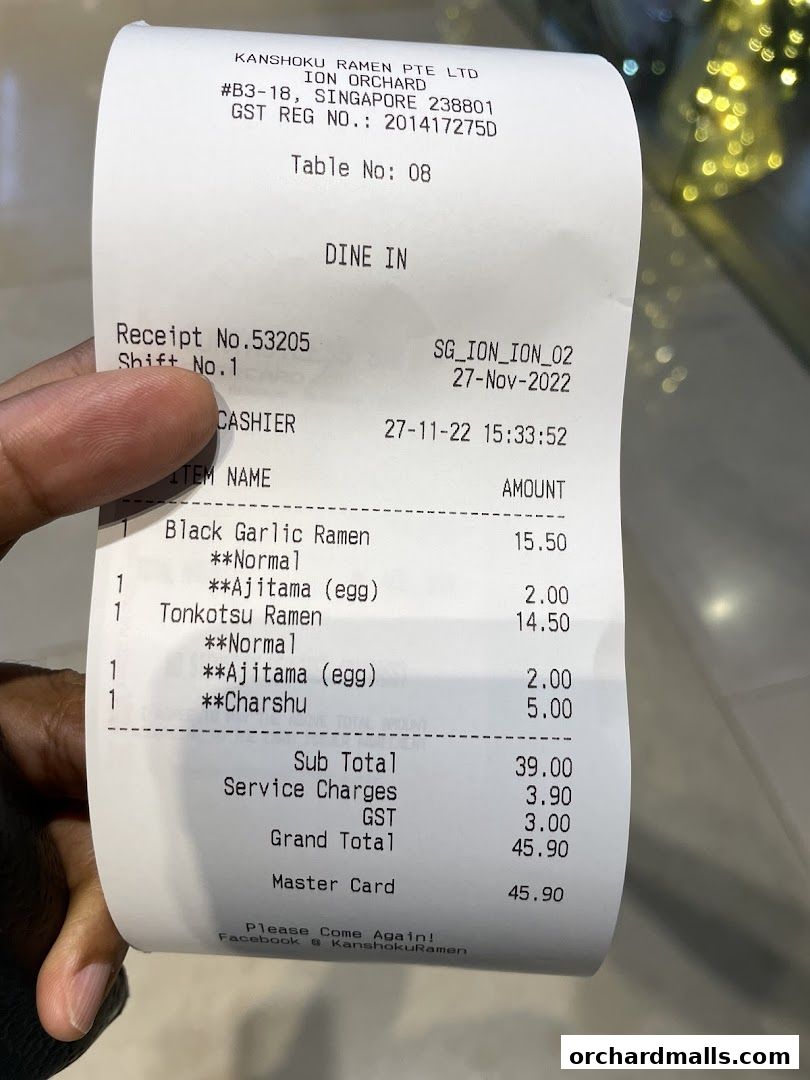 A receipt from Kanshoku Ramen Bar ION Orchard detailing a dine-in order with ramen and toppings.