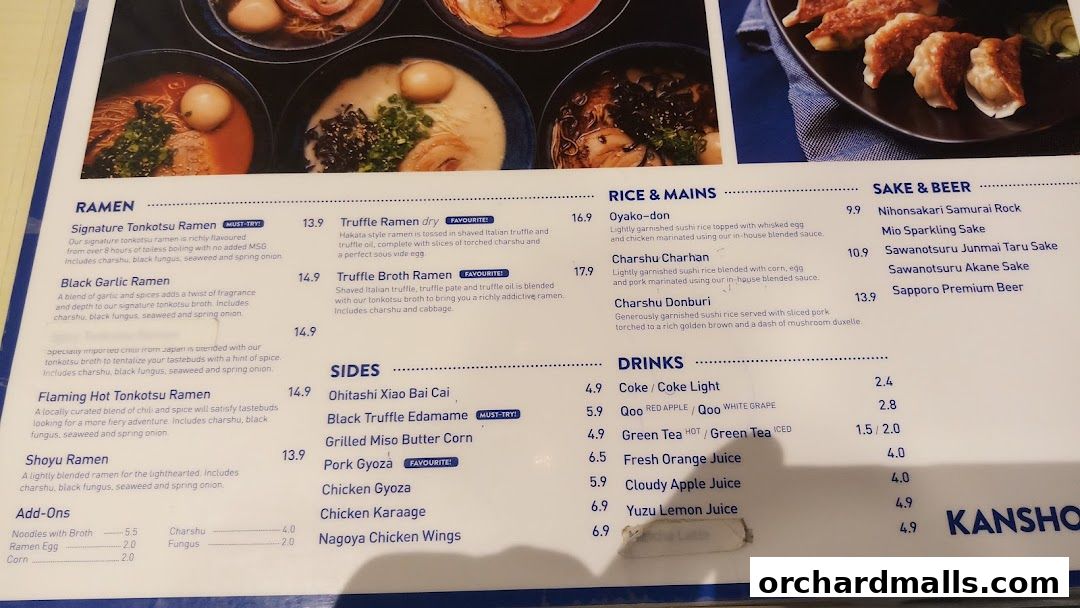 A menu from Kanshoku Ramen Bar featuring ramen, rice dishes, sides, drinks, and sake/beer.