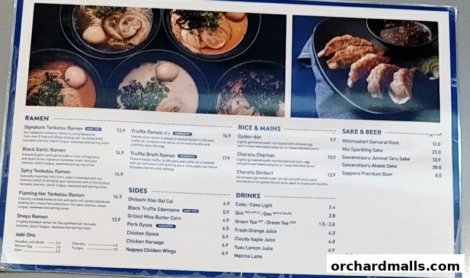A menu from Kanshoku Ramen Bar featuring ramen, rice dishes, sides, drinks, and sake.