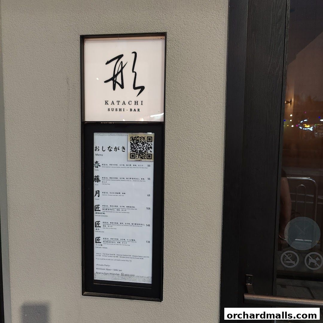 A menu board for Katachi Sushi Bar displays various sushi items and prices.