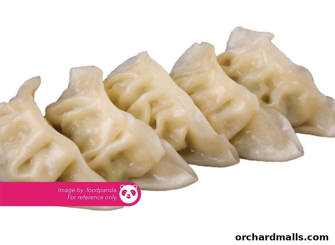 A close-up shot of five steamed dumplings arranged in a row.