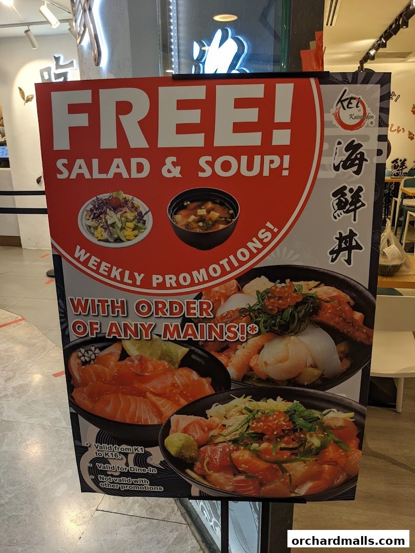 A promotional sign for Kei Kaisendon offering free salad and soup with any main order.
