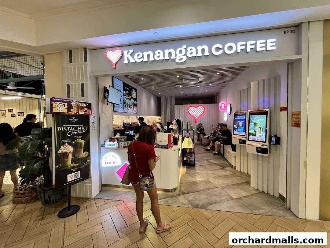 Kenangan Coffee shop front with customers ordering and waiting inside.