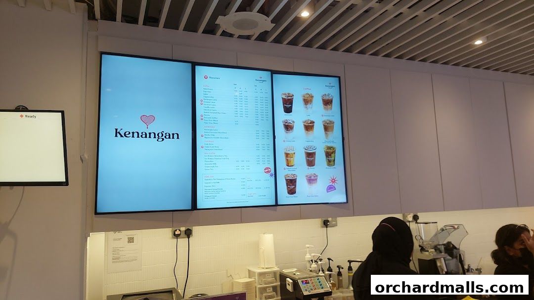 Digital menu board displaying Kenangan Coffee's signature drinks and coffee options.