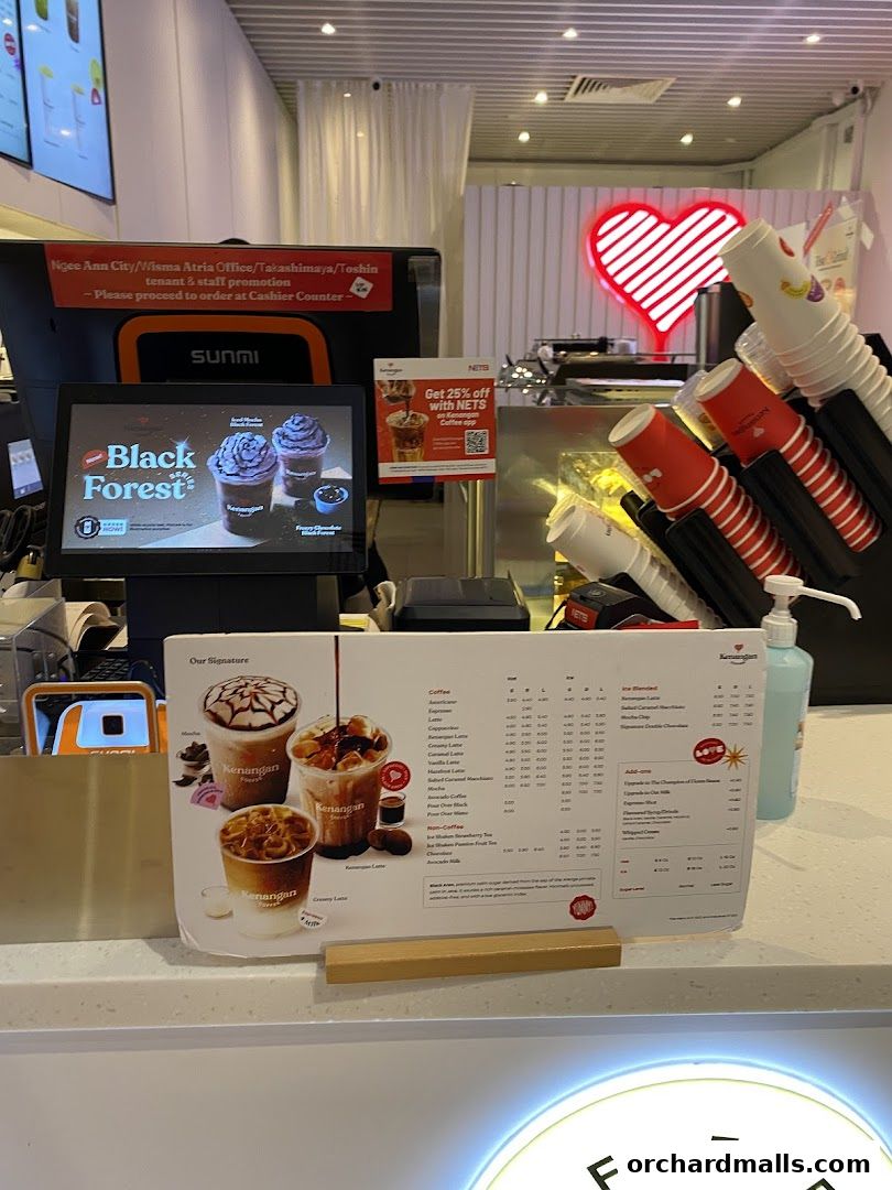 A menu display at Kenangan Coffee Takashimaya Shopping Centre with signature drinks.