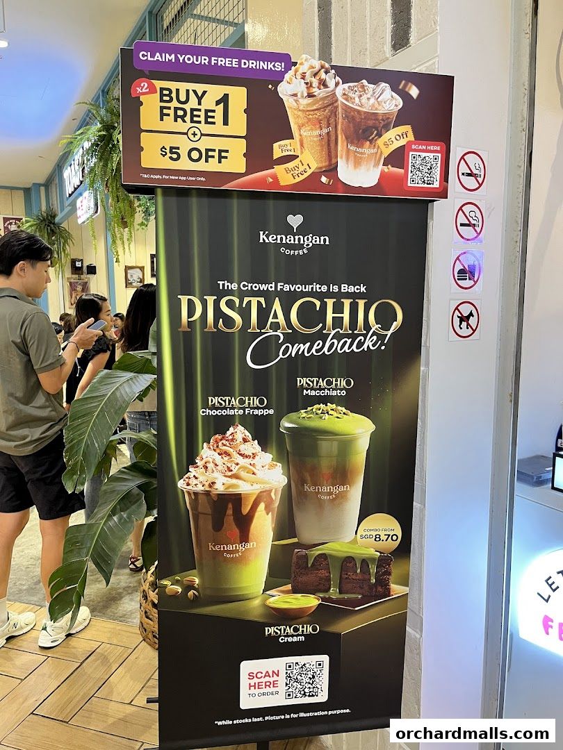 A promotional banner for Kenangan Coffee featuring pistachio drinks and a special offer.