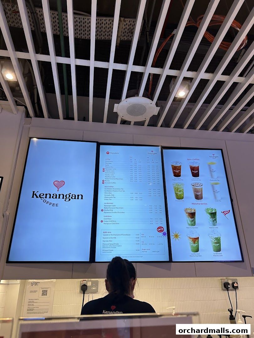A digital menu board displaying coffee and matcha drinks at Kenangan Coffee.