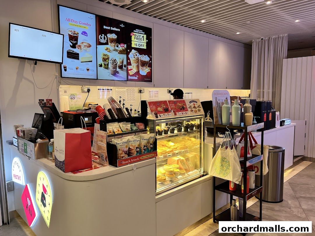 Interior view of Kenangan Coffee Takashimaya Shopping Centre counter with displays.