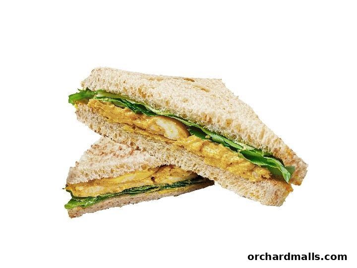 A delicious sandwich with whole wheat bread, lettuce, and a creamy filling.