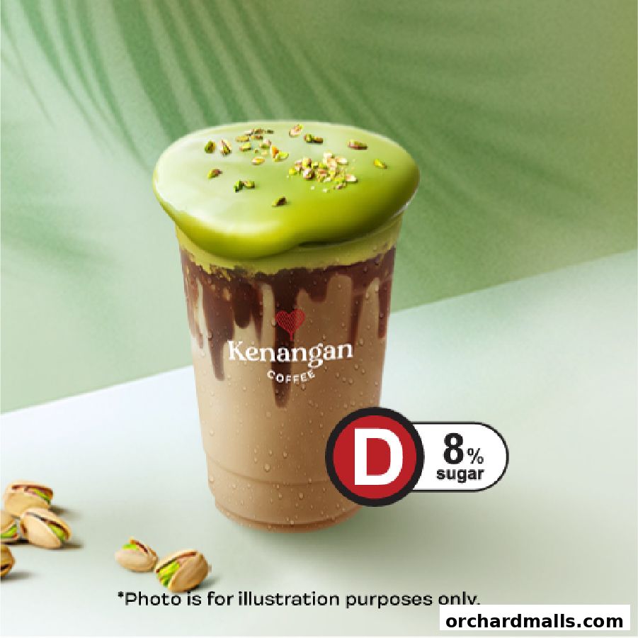 A delicious-looking coffee drink with green topping and pistachios.
