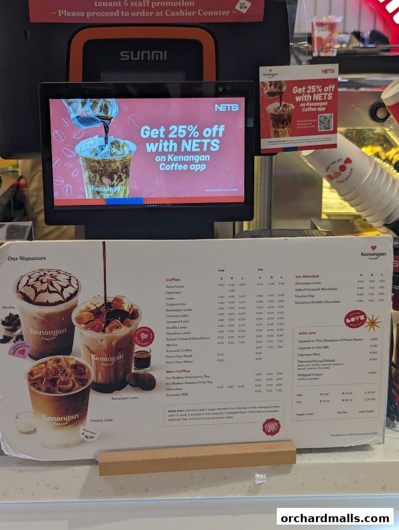 A menu board displaying coffee and non-coffee drinks with prices at Kenangan Coffee.