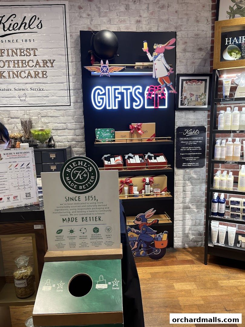 Kiehl's store interior featuring skincare products, gift sets, and promotional displays.