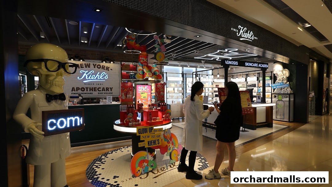 Kiehl's store interior with a skeleton mascot, product displays, and customers.