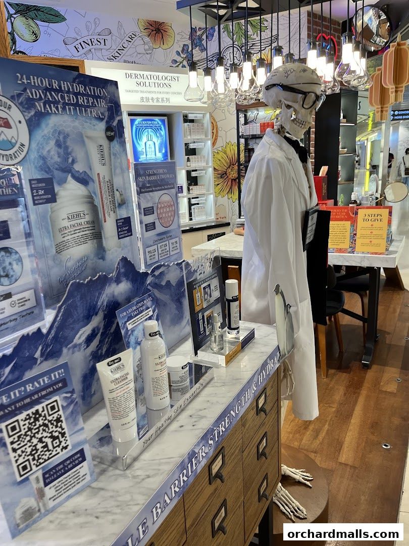 Kiehl's store display featuring skincare products and a skeleton dressed as a scientist.