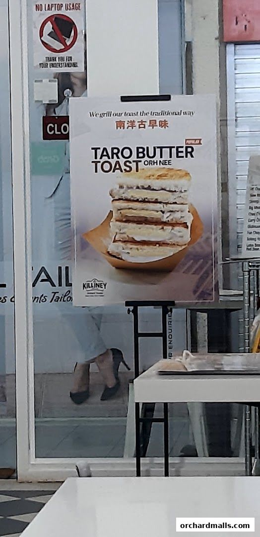 A sign advertising Taro Butter Toast from Killiney Kopitiam at Orchard Towers.