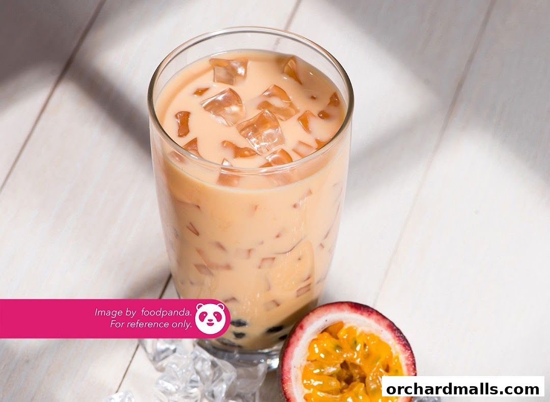 A refreshing iced milk tea with passion fruit and tapioca pearls.