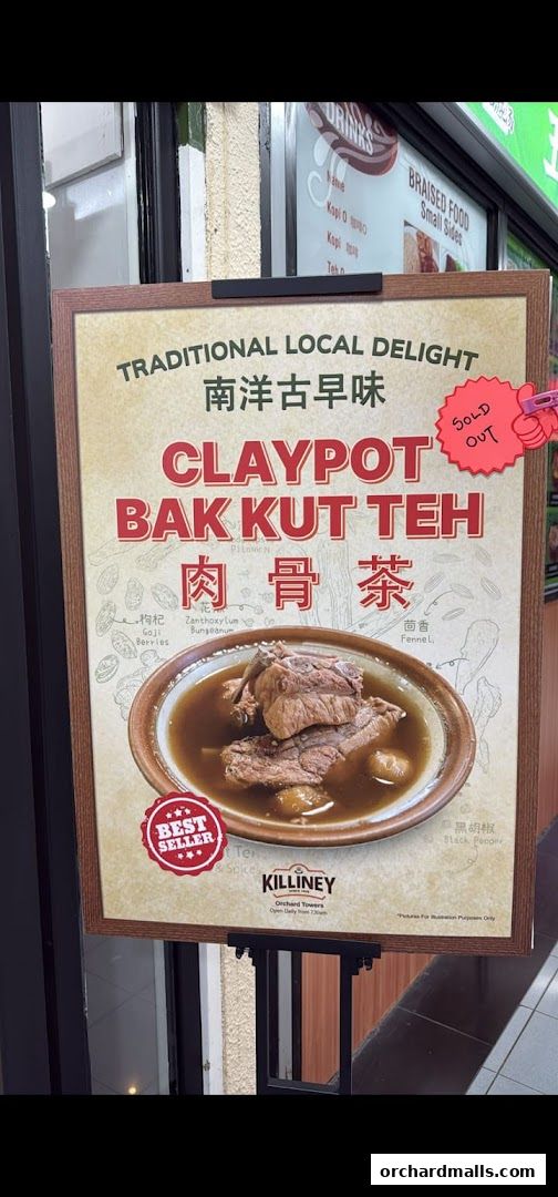 A sign advertising Killiney Kopitiam's Claypot Bak Kut Teh, a traditional local delight.