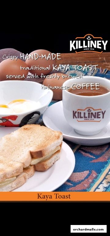 A close-up of Killiney Kopitiam's signature Kaya Toast with soft-boiled eggs and Hainanese coffee.