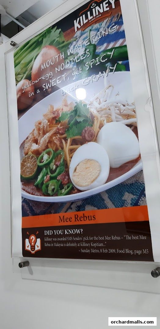 A poster advertising Killiney Kopitiam's Mee Rebus, highlighting its award-winning status.