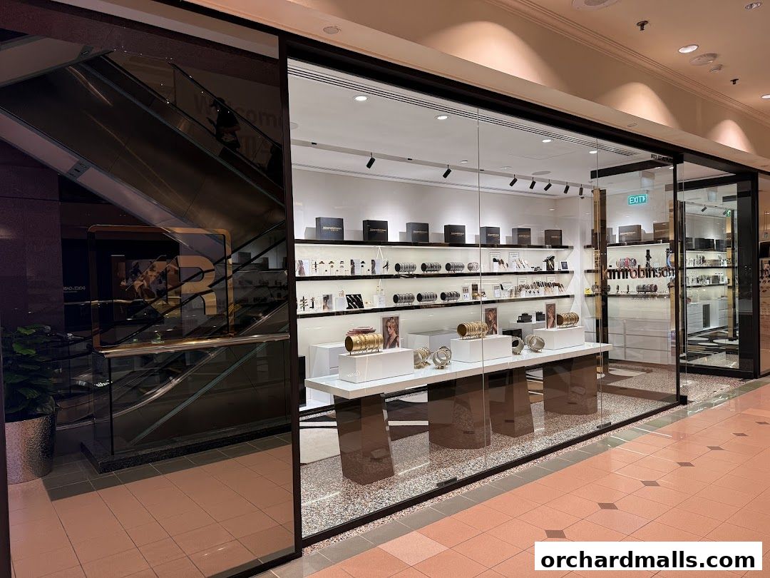The storefront of kimrobinson, showcasing jewelry and accessories in a well-lit display.