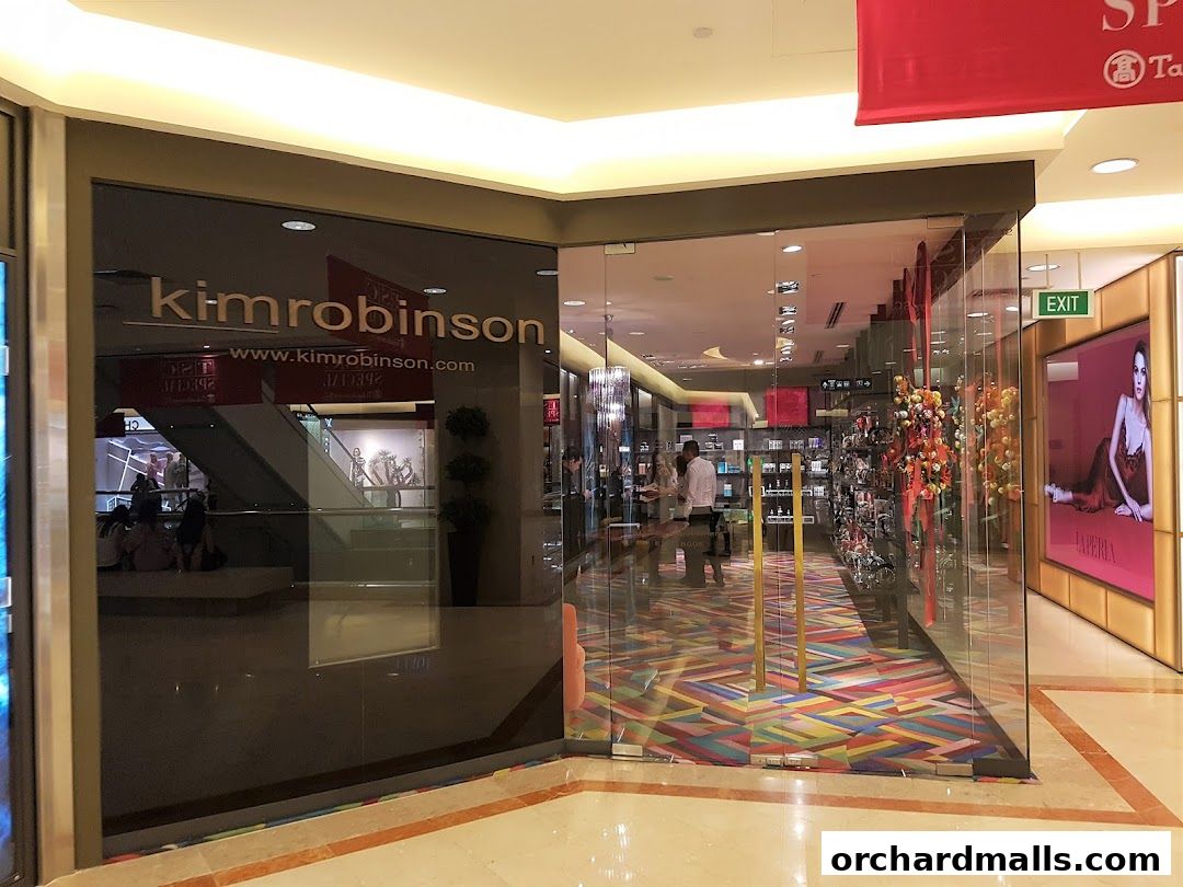 The entrance to the kimrobinson shop with a colorful floor and displays inside.
