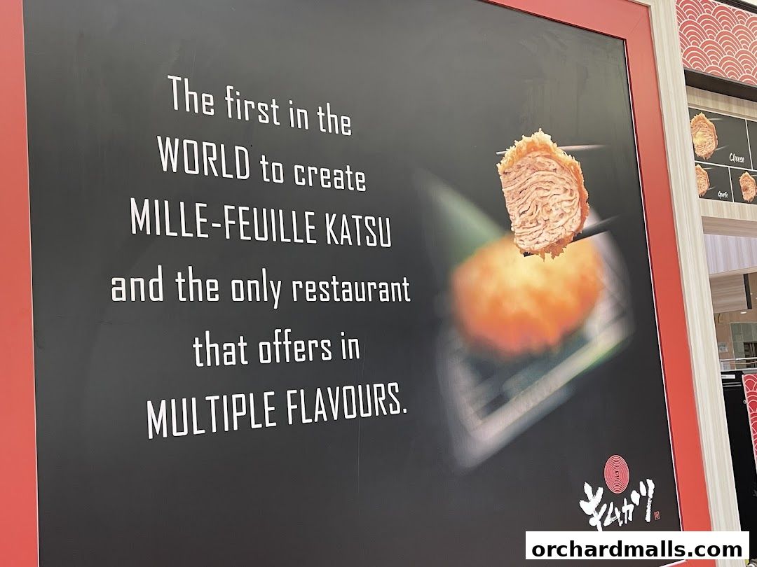 A sign for KIMUKATSU restaurant showcasing their signature Mille-Feuille Katsu.