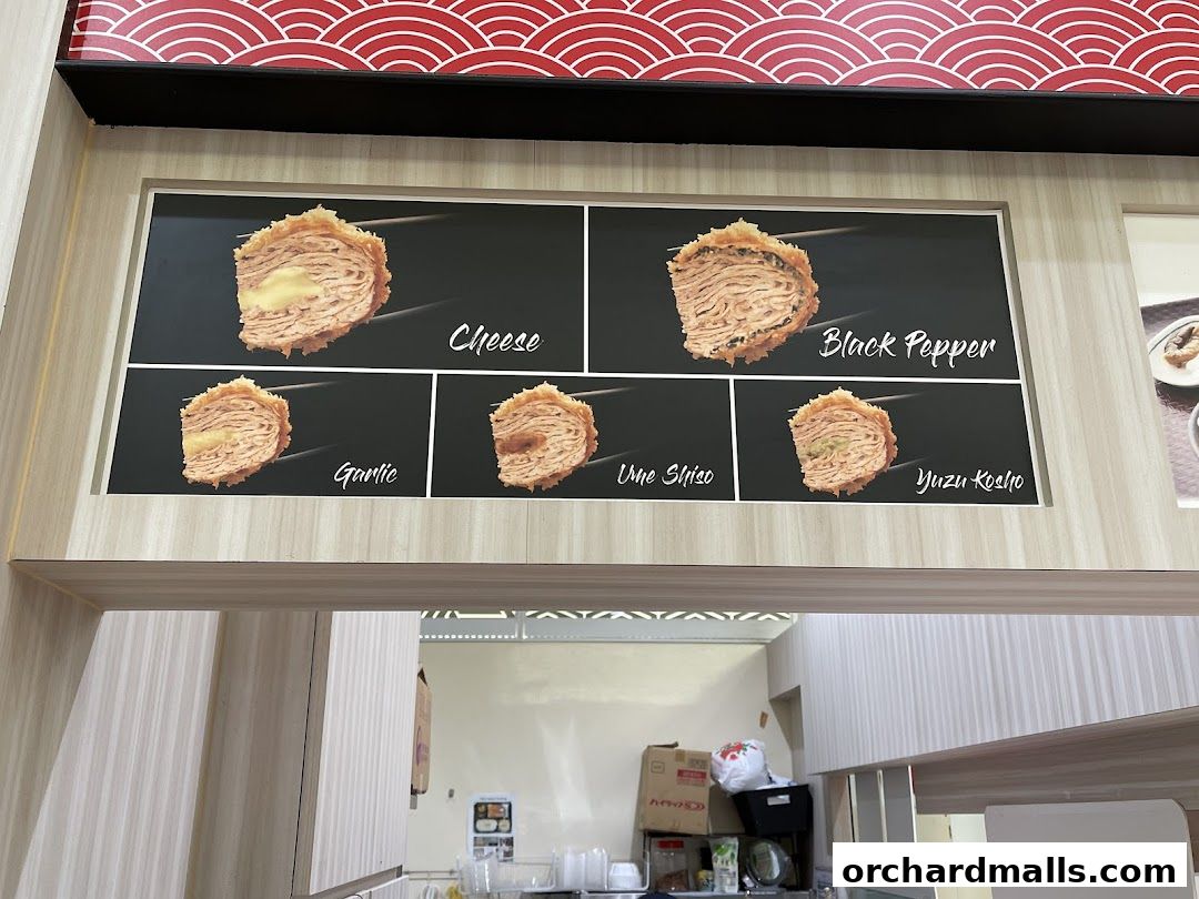 A display board showcasing different flavors of katsu.