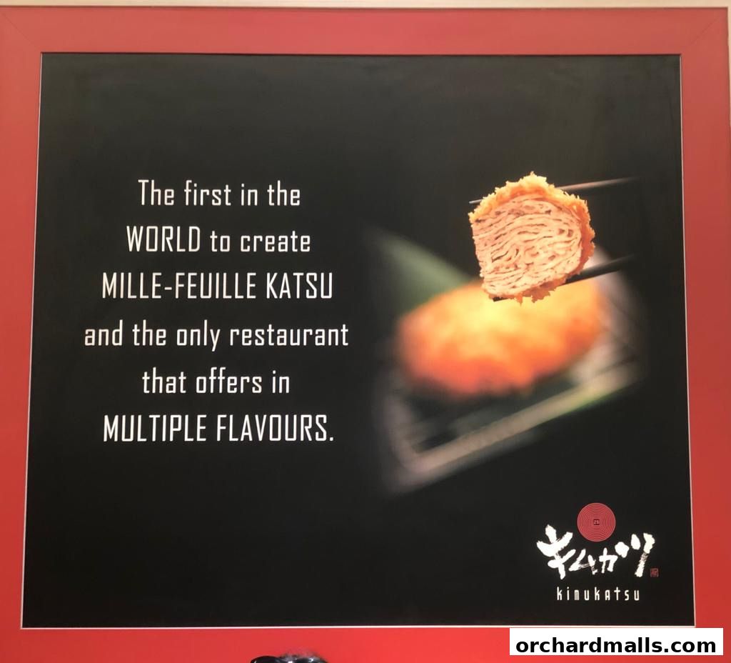 A sign for KIMUKATSU restaurant showcasing their signature Mille-Feuille Katsu.