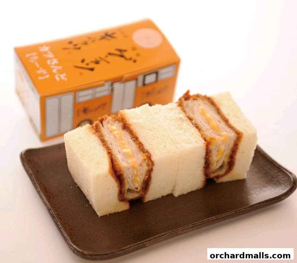 A delicious katsu sandwich with cheese, served with its branded packaging.