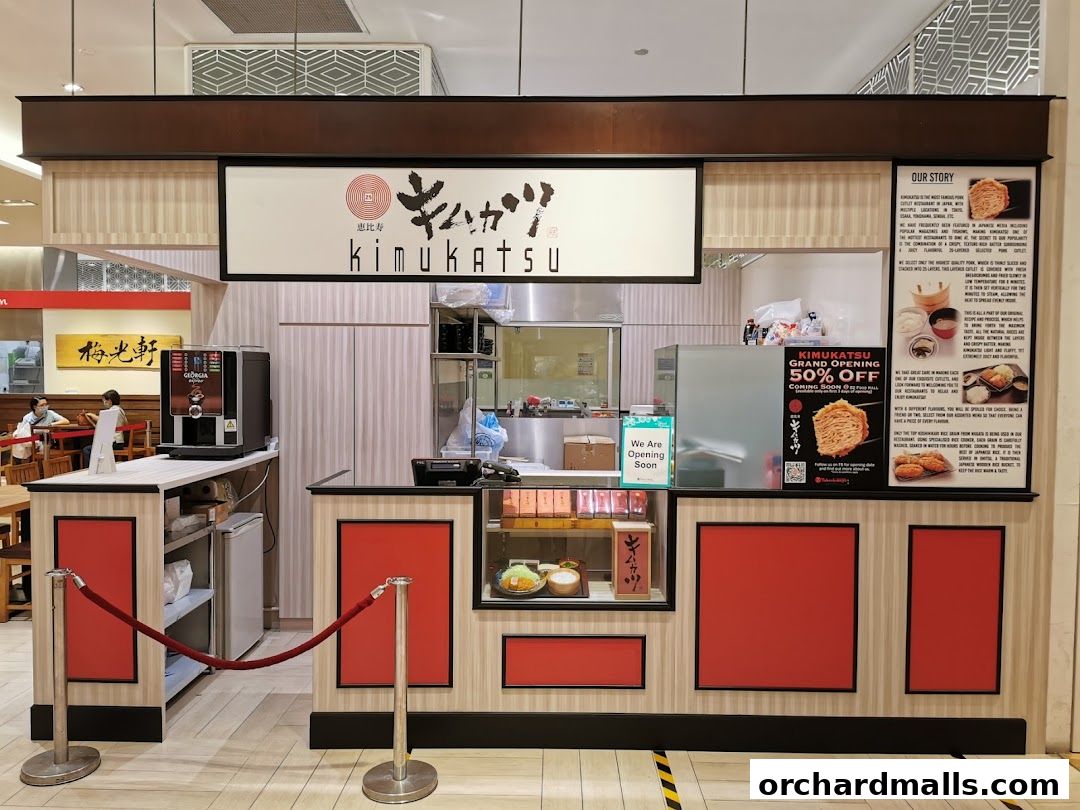 The Kimukatsu shop front with a 'We Are Opening Soon' sign and a grand opening offer.