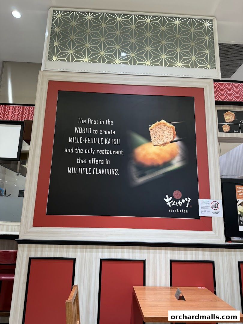 A sign for Kimukatsu restaurant advertising Mille-Feuille Katsu in multiple flavors.