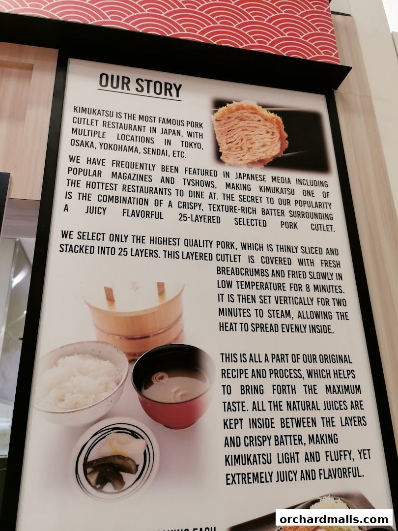 A sign detailing the story and preparation of Kimukatsu's signature pork cutlet.