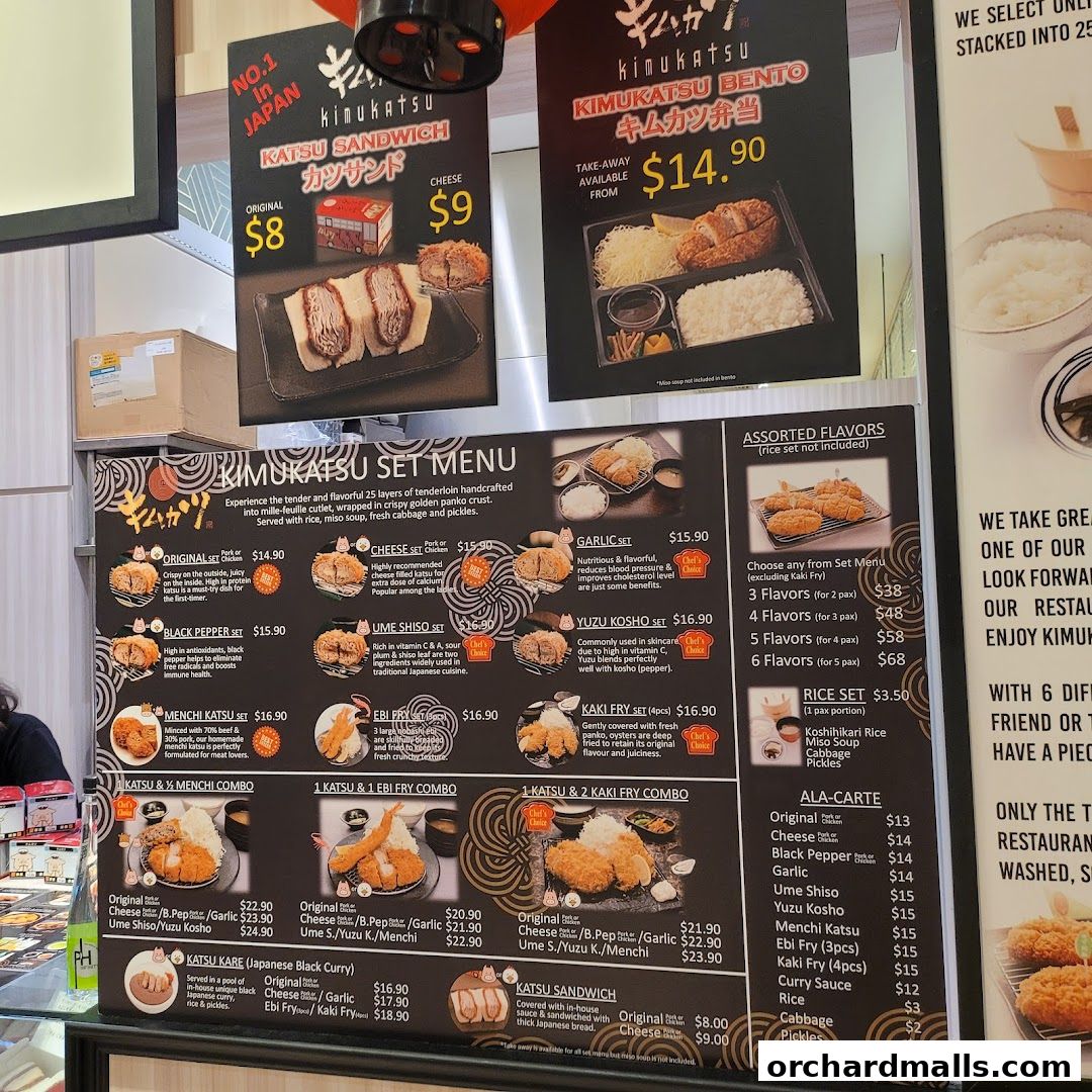 A menu board displaying various katsu sets, sandwiches, bentos, and ala-carte options.