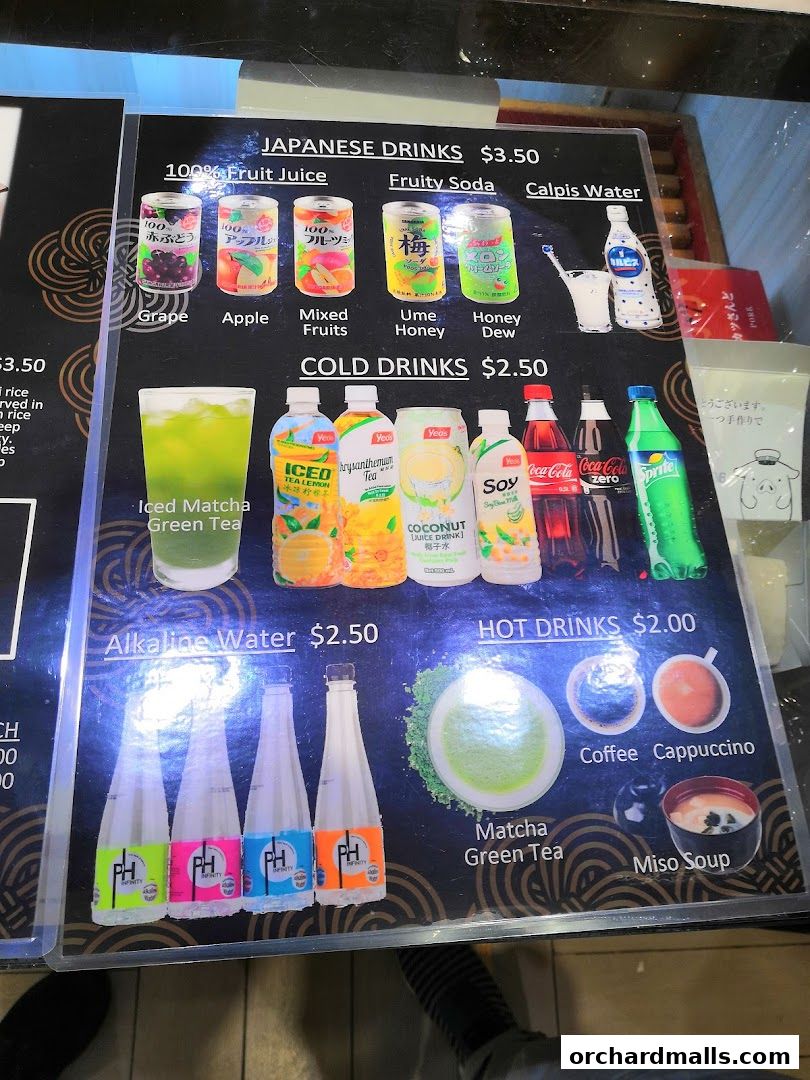 A menu board displaying various Japanese, cold, and hot drinks with prices.