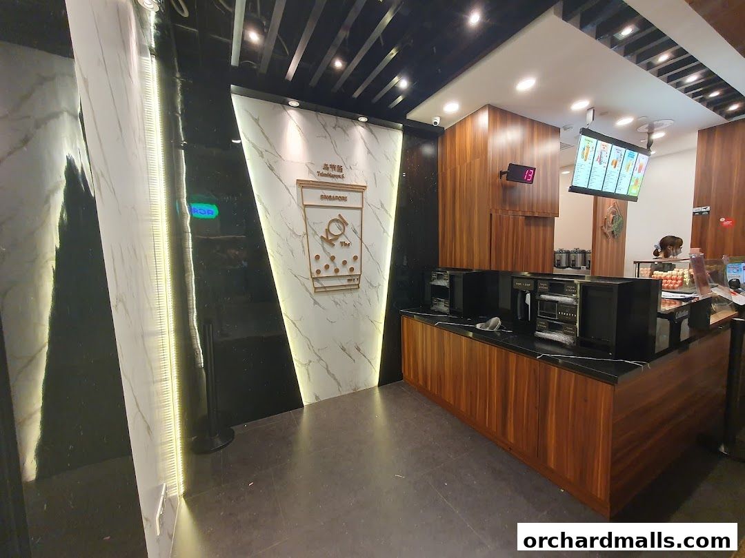 Interior view of KOI Thé Express Takashimaya with a counter and menu display.
