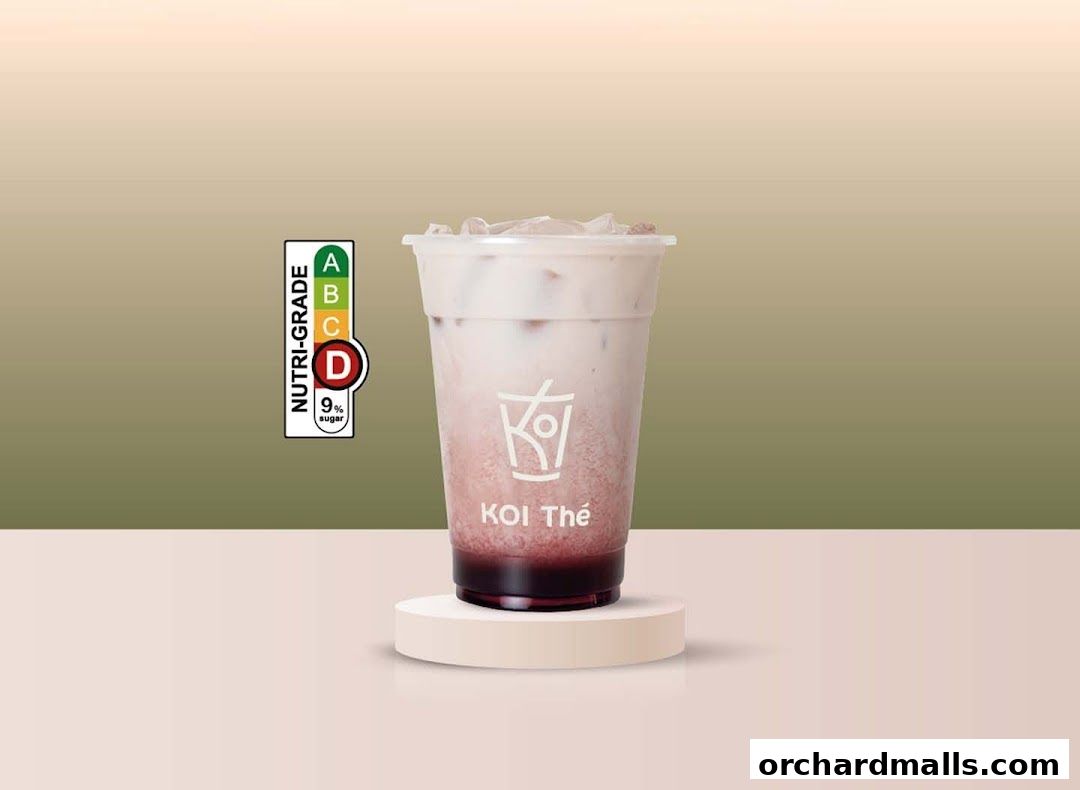 A KOI Thé drink with a Nutri-Grade label showing 9% sugar.