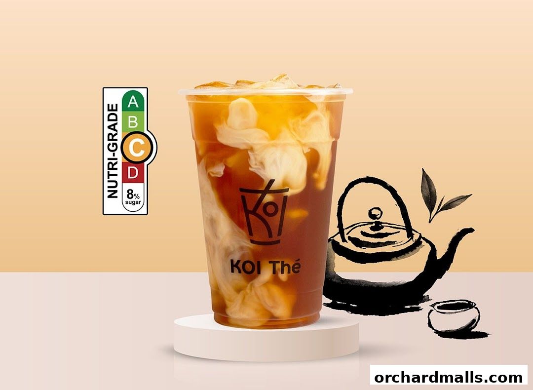A cup of KOI Thé with cream swirls and a Nutri-Grade C label.