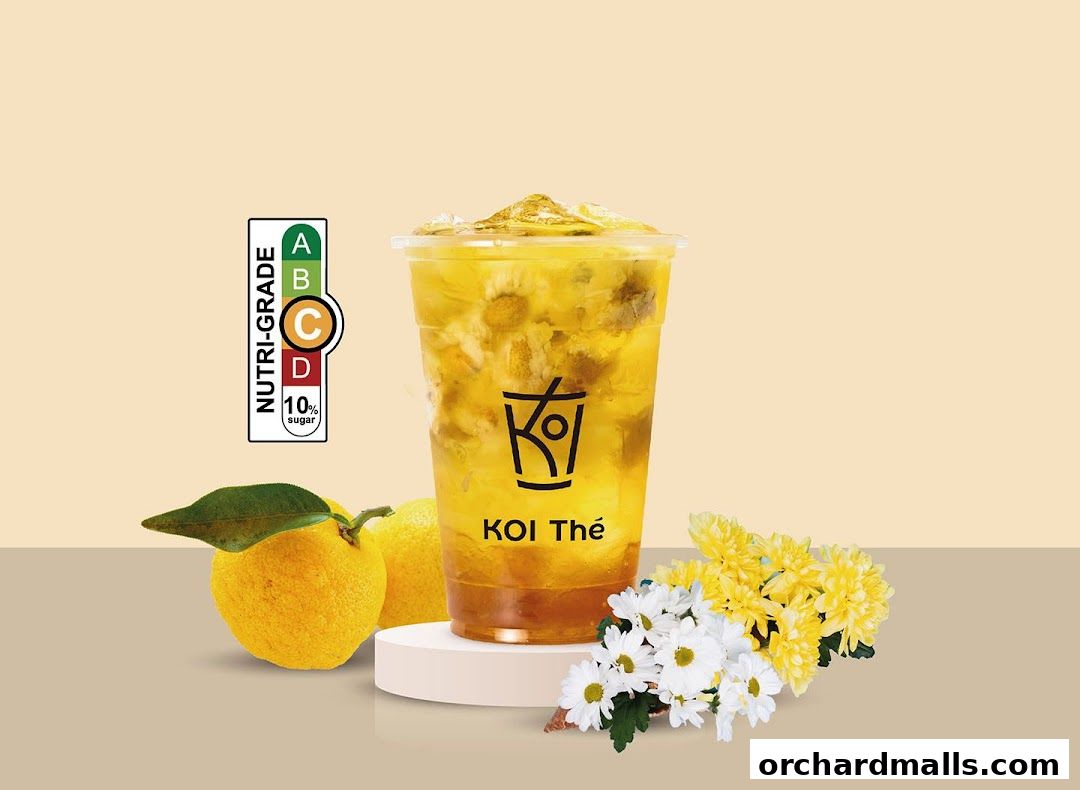 A refreshing KOI Thé drink with citrus fruits and flowers, featuring a nutri-grade label.