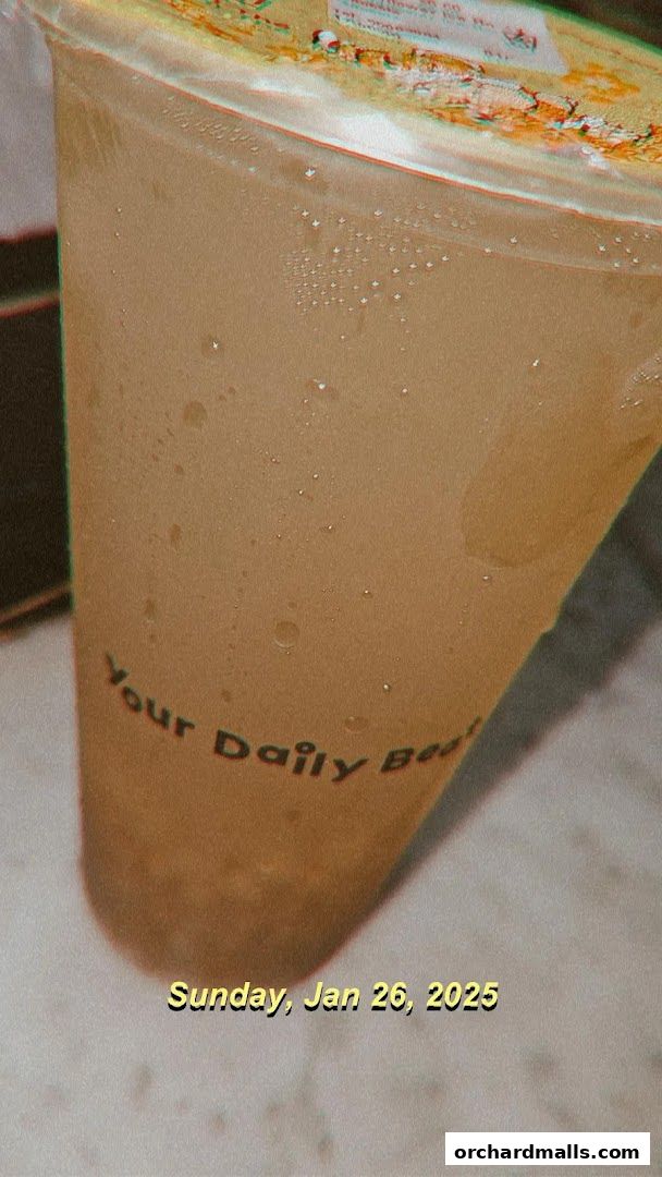 A close-up of a refreshing beverage from KOI Thé with condensation on the cup.