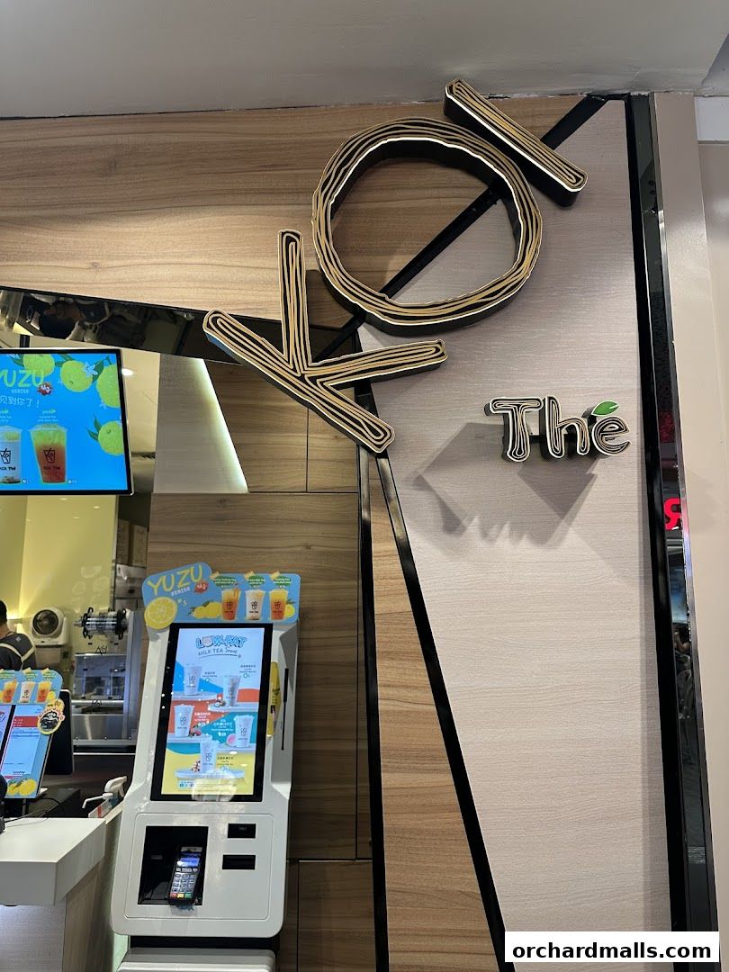The KOI Thé ION shop features a prominent logo and a self-order kiosk with drink promotions.