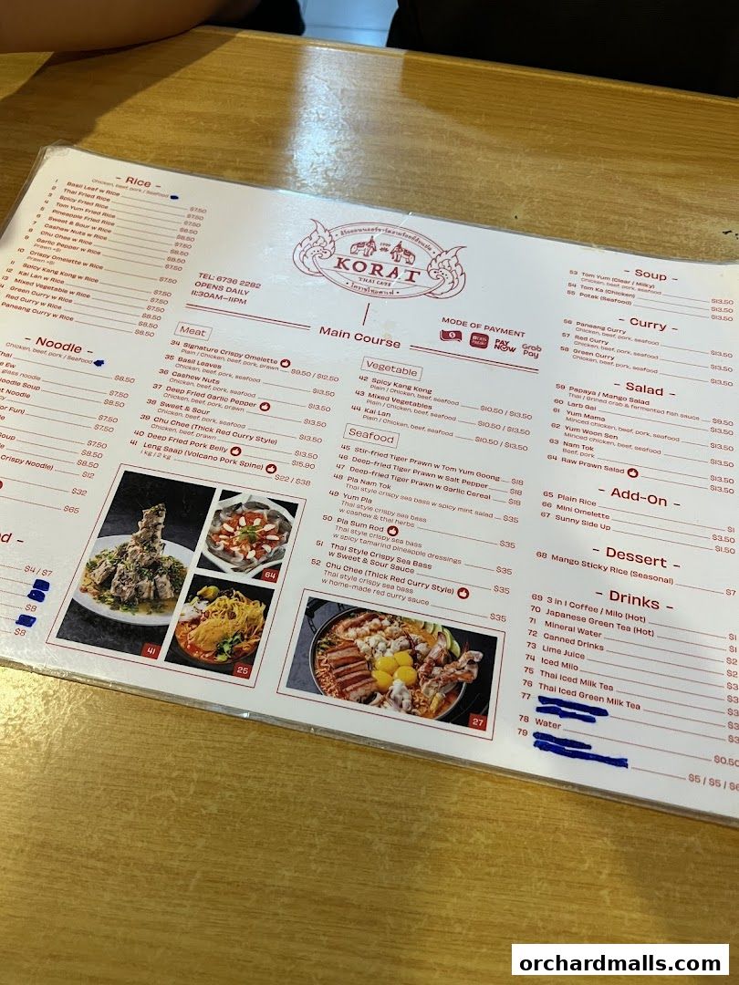 A menu from Korat Thai Cafe with various Thai dishes and drinks listed.