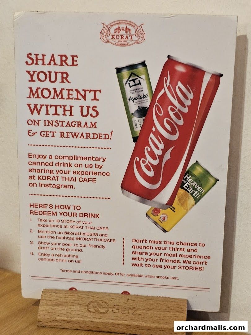 A promotional flyer for Korat Thai Cafe offering a free drink for Instagram stories.